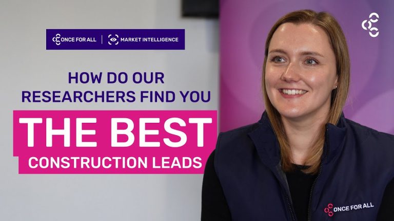 Sophie stands in a once for all jacket before a colourful background, with the video title of 'how do our researchers find the best construction leads overlayed.